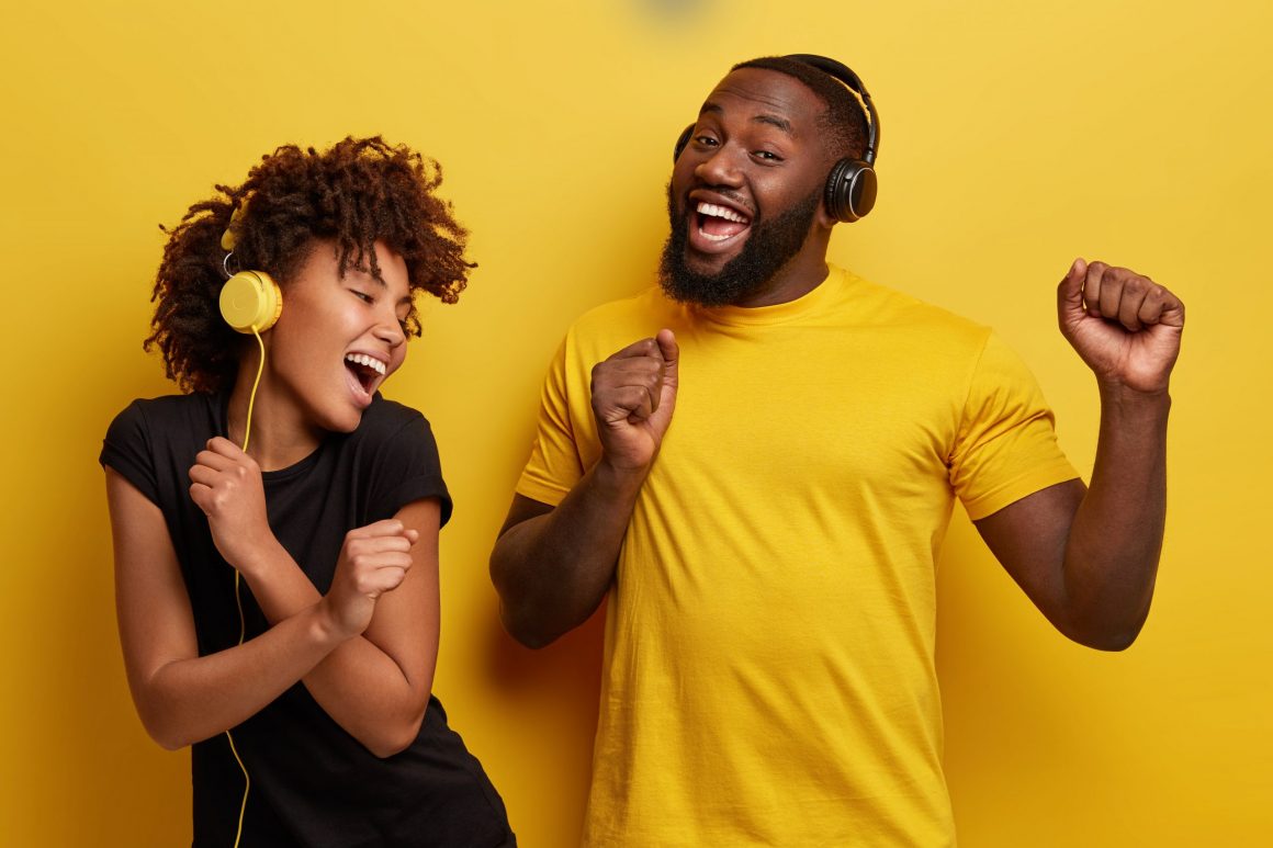 Couple listening to music in yellow